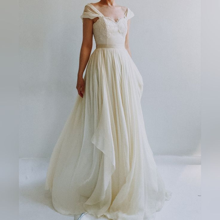 Anyone Searching For A Super Romantic Jane Austen/Pride And Prejudice-Esque Type Of Gown? Handmade In The Usa, 100% Pure Silk Gown. Still Completly Brand New With Tags In Place. Unworn Except When I Tried It On Once. Handmade In Nyc From Leanne Marshall. Bodice Has Boning For Structure With Beautiful Lace. Gown Has Small Silk Train That Trails Behind As You Walk And Flutters Every Which Way. This A-Line Gown Is A Size 10. For Reference, I Have A 36" Bust And A 29" Waist. This Gown Fits Large On Wedding Gown Color, Ethereal Gown, Empire Waist Wedding Dress, Types Of Gowns, Leanne Marshall, Traditional Gowns, Duchess Satin, Davids Bridal Dresses, Ivory Silk