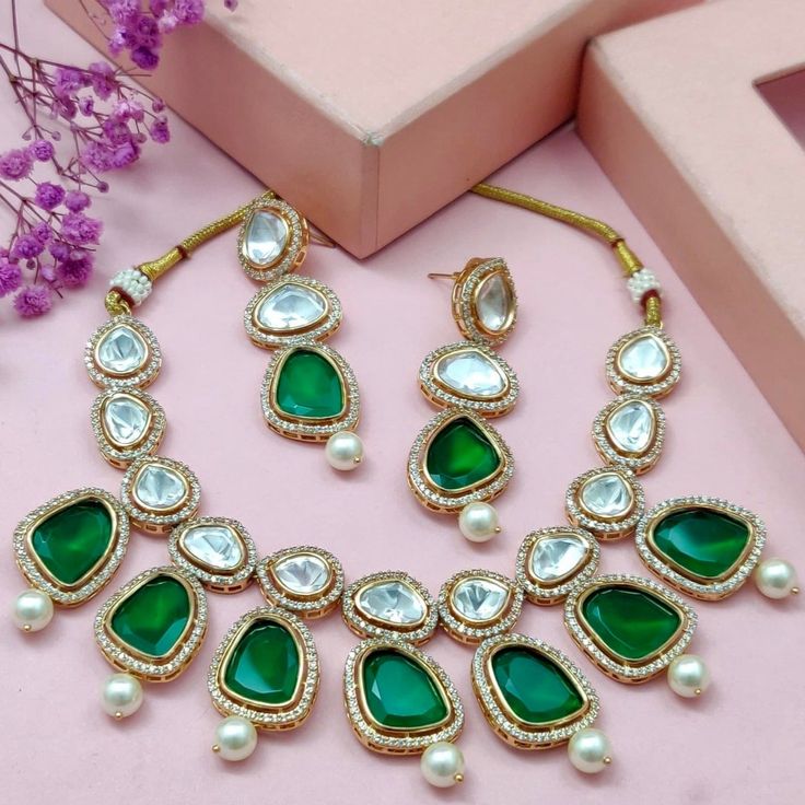 Step into elegance with our Uncut Kundan Necklace Set in Emerald, part of our Royal Heritage Collection, a stunning fusion of luxury and grace. Crafted meticulously, this necklace set captures the essence of American chic and Indian artistry. The soft hues of clear stones and radiant gold intertwine seamlessly, offering a touch of opulence to any ensemble. Lightweight and refined, they embody sophistication and cross-cultural allure, making every moment a statement of timeless beauty. Handcrafte Hand Harness, Kundan Necklace Set, Earrings Stone, Pearl Bangle, Bangle Ring, Kundan Necklace, Kundan Necklaces, Foot Jewelry, Clear Stone