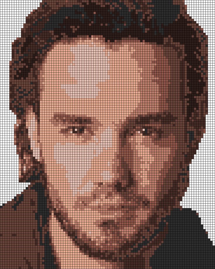 a pixellated photo of a man with brown hair