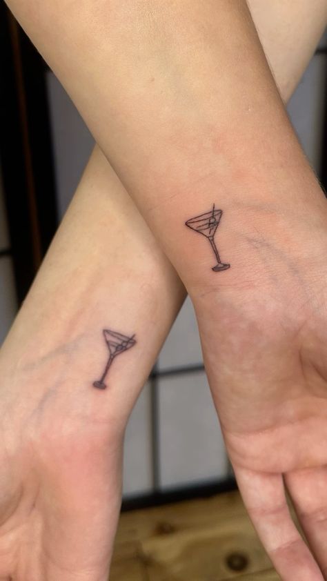 two people with matching tattoos on their arms