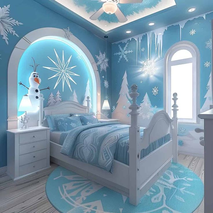 a bedroom decorated in blue and white with snowflakes