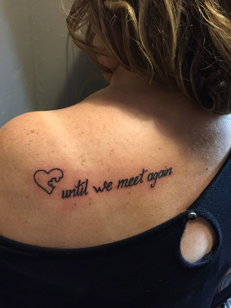 the back of a woman's shoulder with an inscription that reads until we meet again