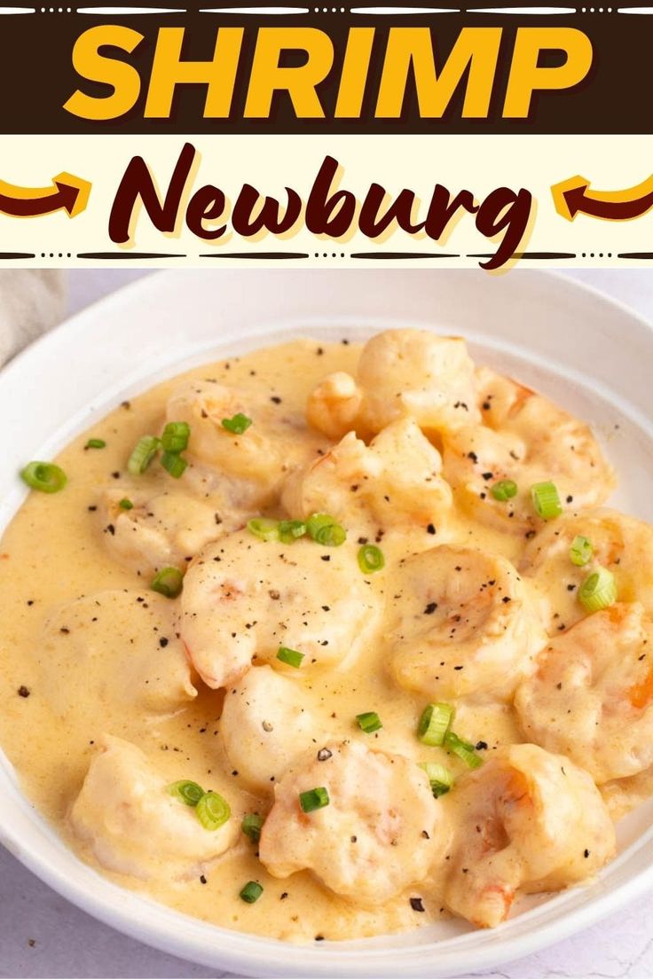 shrimp and dumplings in a creamy sauce with green onions on top, served in a white bowl