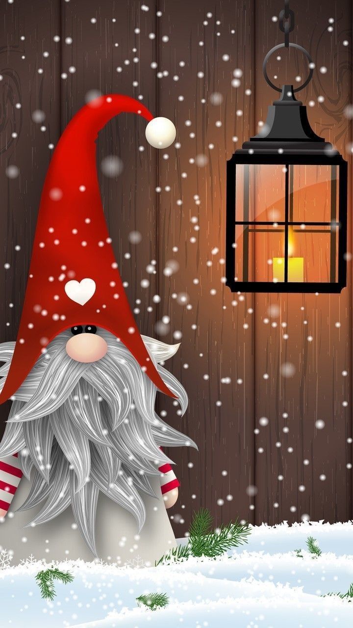 a christmas gnome with a lantern in the snow next to a fence and a wooden wall