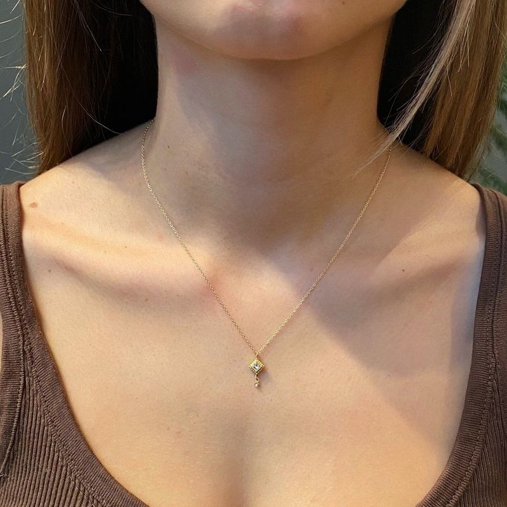 This sweet little necklace features a brilliantly sparkling square diamond, set in 22k gold and accented with a tiny diamond drop. Hangs on a delicate 14k chain. Square setting measures approximately 1/4 inch tall (from point to point). Shown at 16 inch chain length on model. Matte finish. Gold Minimalist Diamond Necklace With Teardrop Pendant, Delicate Yellow Gold Necklace With Square Pendant, Gold Minimalist Diamond Teardrop Pendant Necklace, Delicate Yellow Gold Square Pendant Necklace, Gold Minimalist Teardrop Diamond Necklace, Dainty Yellow Gold Square Pendant Charm Necklace, Dainty Yellow Gold Charm Necklace With Diamond Accents, Gift Yellow Gold Diamond Necklace With Square Pendant, Yellow Gold Square Pendant Diamond Necklace As A Gift