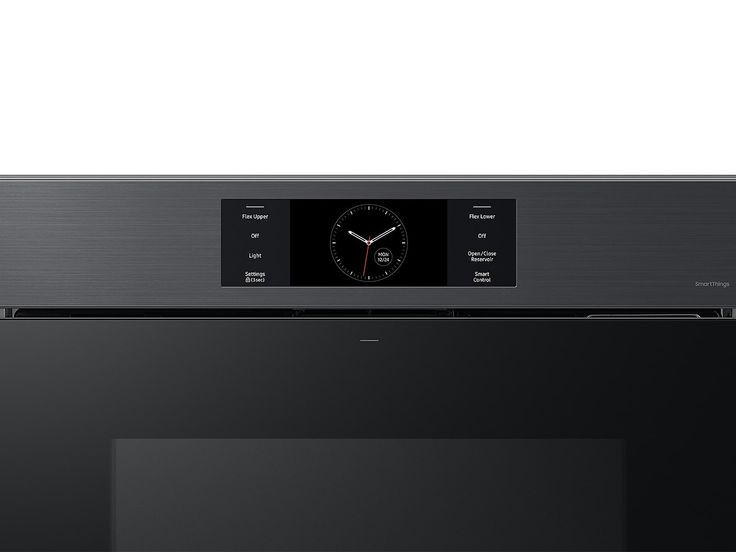 a black microwave oven with a clock on the front and side panel in stainless steel