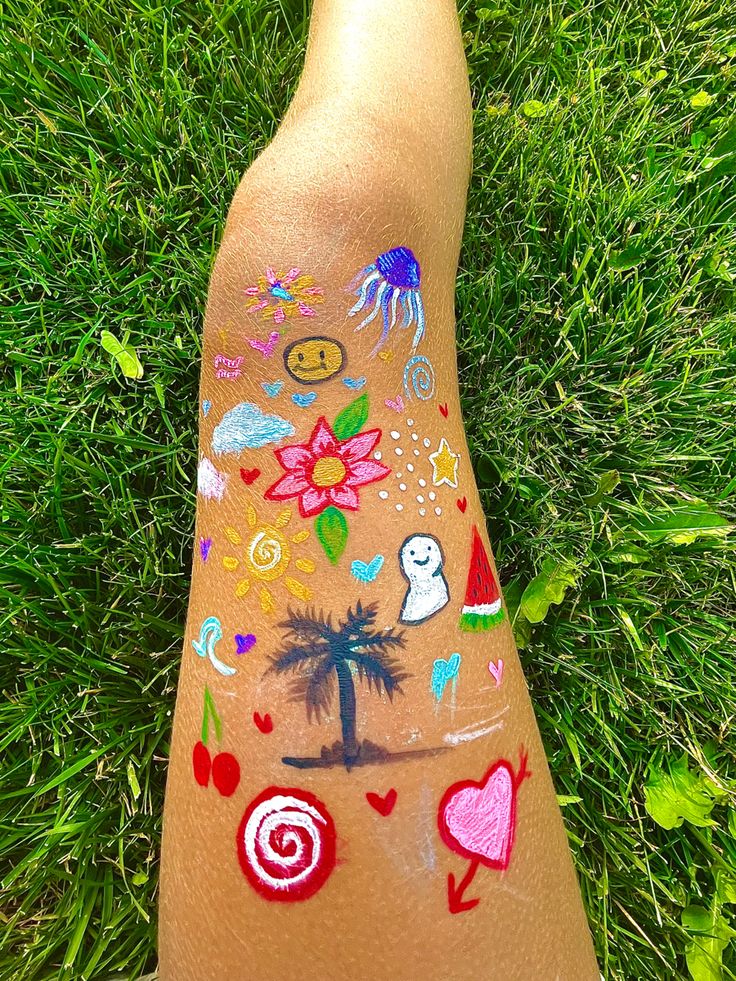 someone has their foot painted with many different things on the body and it looks like they are