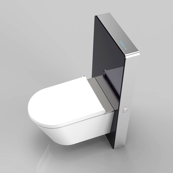 a white toilet sitting on top of a gray floor next to a wall mounted device