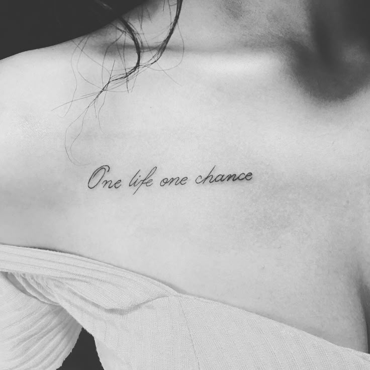 a woman's chest with the words one life, one chance written on it