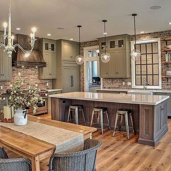 a large kitchen with an island in the middle