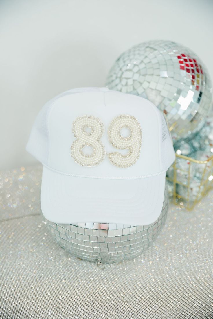 We are obsessed with these custom Judith March Beaded number hats! Whether you want your team number, enneagram, or favorite date, we will customize it for you. Number patches are only available in the White Beaded patch style. **If this product is purchased without adding/paying for custom numbers, your order will be cancelled. This item cannot be purchased plain.** Since this item is custom, we do not offer refunds, exchanges, or store credit. Once a custom order is placed, we are unable to ch