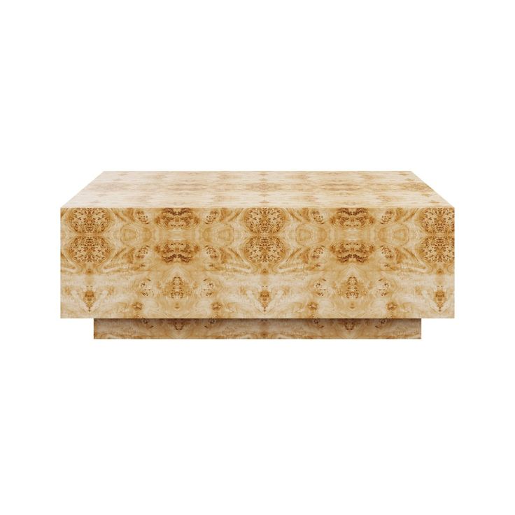 a large wooden box sitting on top of a white surface with an intricate design in the middle