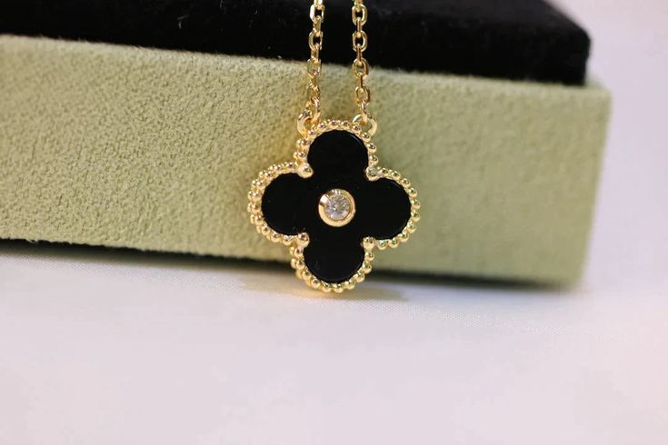 Elevate any outfit with our Clover Necklace in Gold, adorned with a stunning Diamond and Onyx. This timeless piece exudes elegance and sophistication, perfect for any occasion. Let our exquisite design and quality craftsmanship enhance your style and bring good luck to your life. ADDITIONAL INFORMATION Color: Gold Stone: Cubic zirconia, Onyx Ref. 5521 Material:- 925 Sterling Silver - 18k Gold Plated- 18k Real Gold ( contact us via instagram) Our replica products are committed to quality and colo Trinity Bracelet, Detailed Jewelry, Clover Necklace, Love Necklace, Love Bracelets, Gold Chains, Gold Diamond, Onyx, 18k Gold