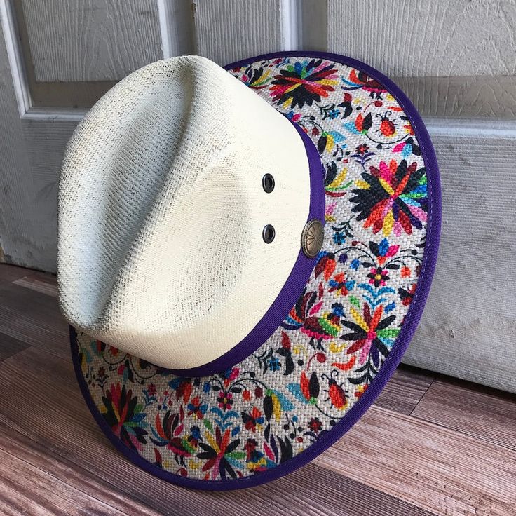 This beautiful Mexican Sombrero has would be perfect to add that special touch to any outfit. MADE IN MEXICO By: Mexican Artisans For: Women Size: Medium 23' Color: off-white | multi Details: Material: palm straw Fabric canvas design Bottom black suede Inner elastic band Contact us for more details PLEASE READ BEFORE PURCHASE: The picture is an ACCURATE REPRESENTATION.Colors in the pictures may vary a little by effects of light. Each product is handmade from Mexico causing differentiation and mi Multicolor Wide Brim Panama Hat In Toquilla Straw, Summer Fedora With Multicolor Flat Brim, White Woven Fedora With Curved Brim, Wide Brim Straw Hat For Cinco De Mayo Festival, Multicolor Toquilla Straw Fedora Hat, Multicolor Toquilla Straw Fedora, Multicolor Toquilla Straw Hat With Curved Brim, Multicolor Fedora Hat In Toquilla Straw, Multicolor Brimmed Fedora For Vacation