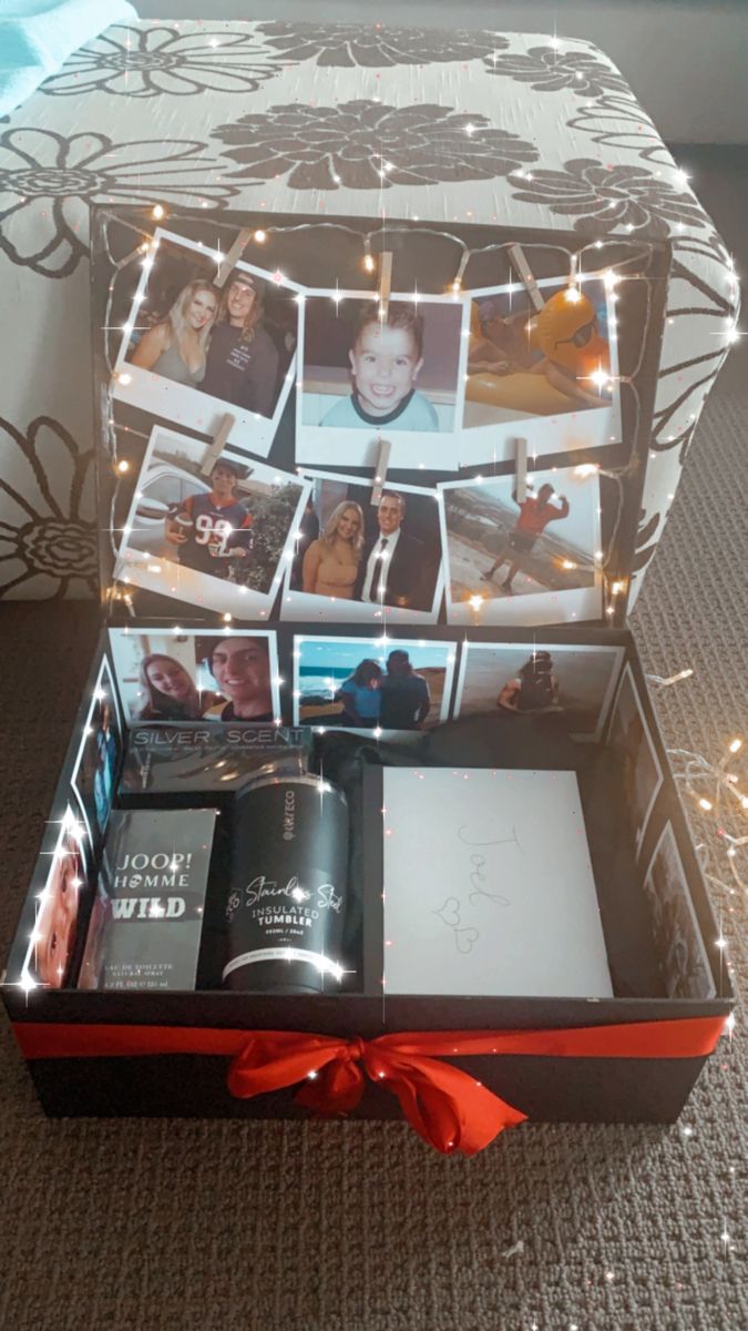 an open gift box with pictures and lights