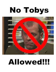 a sign that says no tobbys allowed in front of a man's face