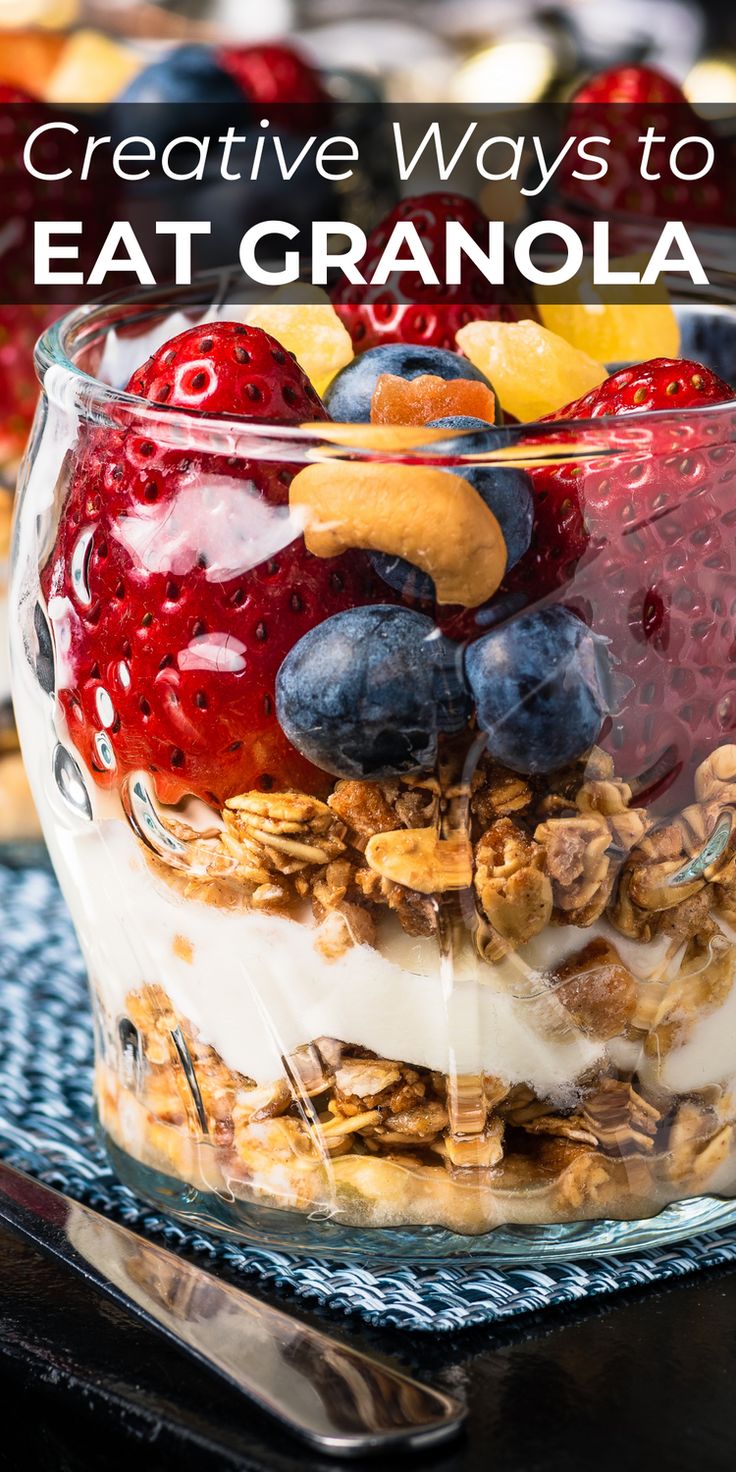 a glass bowl filled with granola and fruit