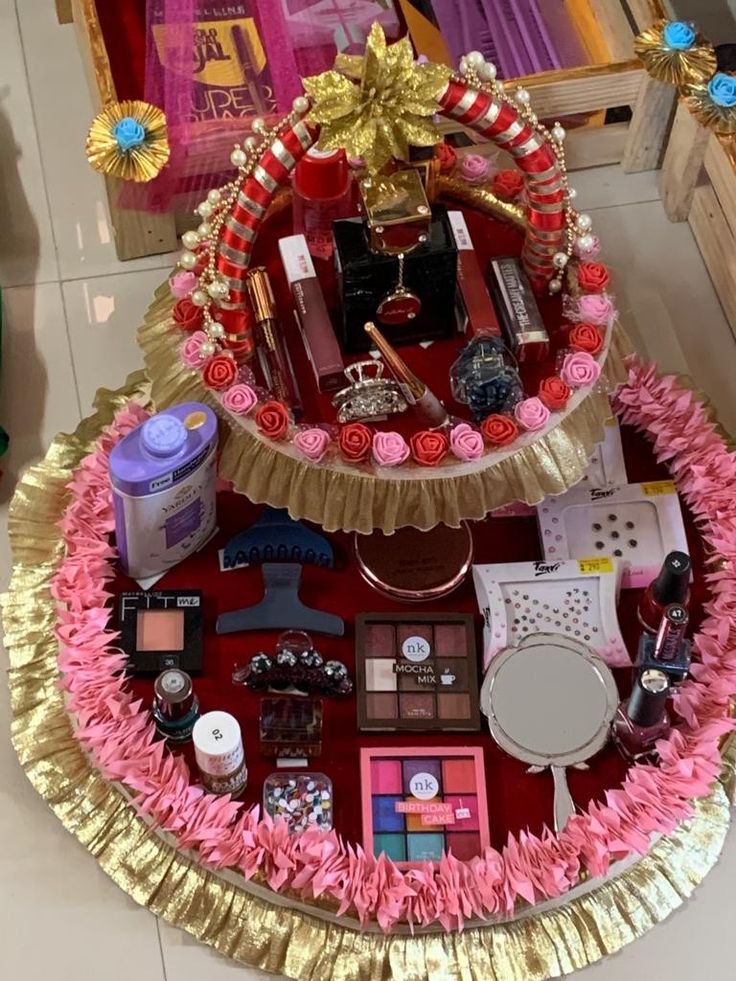 a table topped with lots of different types of cosmetics and makeup products on top of it