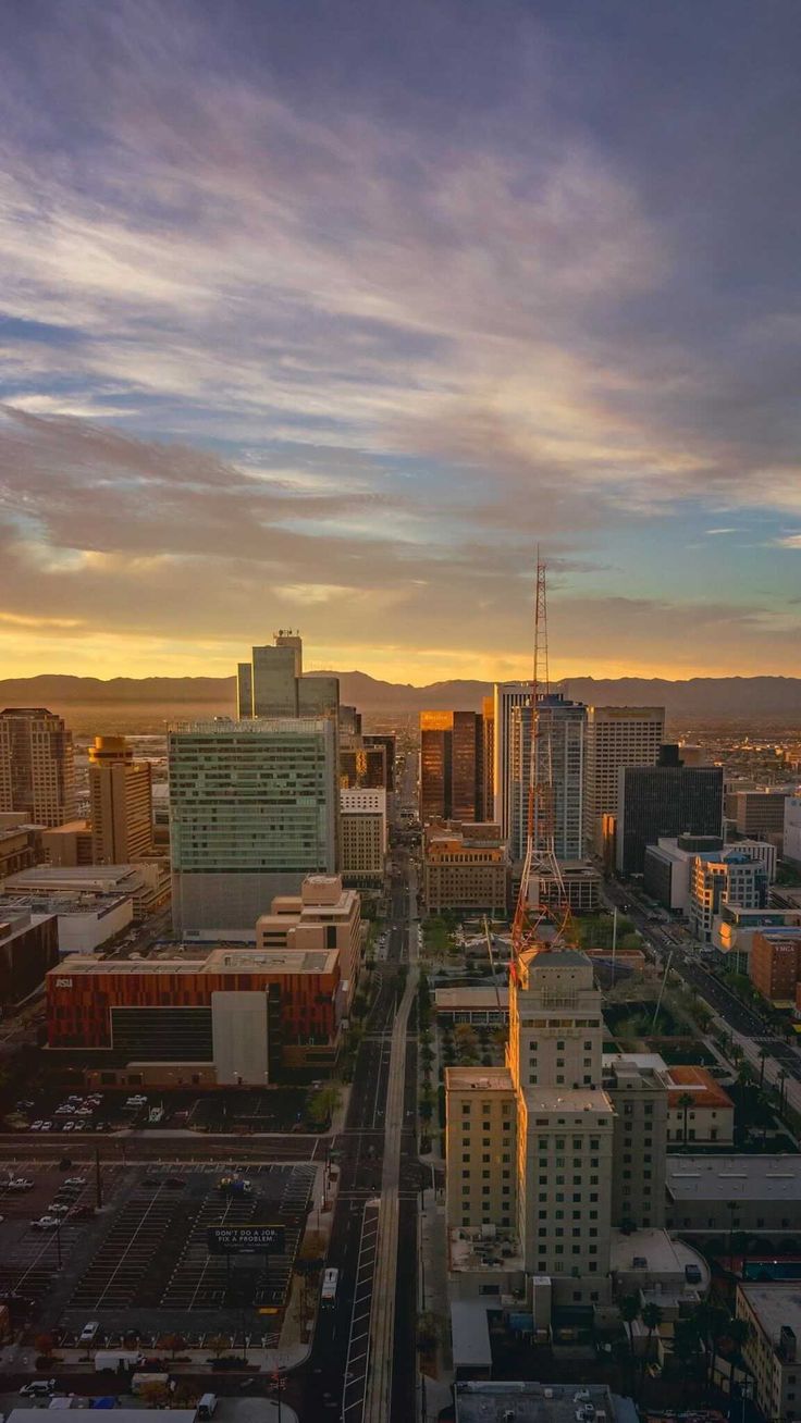 an aerial view of the city at sunset