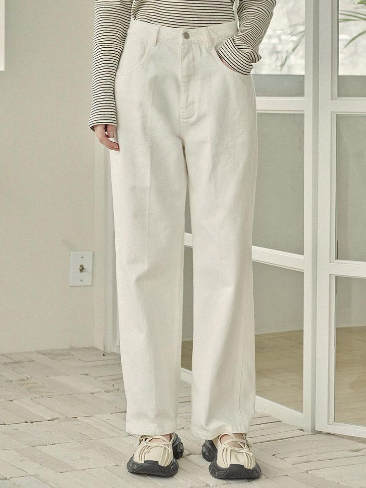 The classic mood denim pants that made of 100% high-quality cotton. Featuring the semi-wide leg fit that create clean silhouette, and the slightly long length is easy to style with various items. The crease line detail at leg makes the legs look slimmer and longer. - Five-pockets styling- Crease line detail at legs that creates slim and long silhouette- Semi-wide leg fit and slightly maxi length- Logo-engraved leather patch at back waistband- High-quality cotton fabric made Classic High-waist Cotton Pants, Classic Solid Cotton Jeans, Solid Cotton Tapered Leg Jeans, Solid Color Cotton Tapered Leg Jeans, Solid Color Tapered Leg Cotton Jeans, Classic Wide Leg Cotton Jeans, Classic Straight Cotton Jeans, Elegant Relaxed Fit Cotton Jeans, Classic Solid Color Jeans For Spring