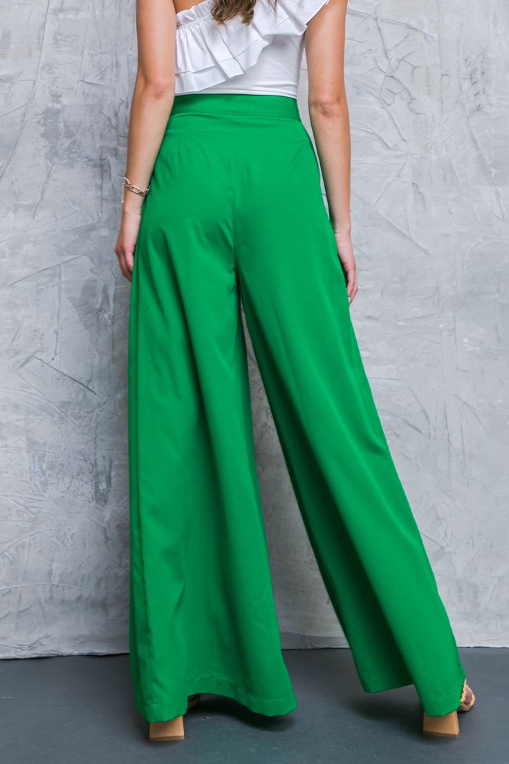 These stylish AT THE WISHING WELL WOVEN PANTS are designed with a waistband, pleated front detail and extra-wide leg. Their side zipper closure provides a secure and comfortable fit, making them perfect for any occasion. Details Self : 100% Polyester Size & Fit - Model is 5`8" And Wearing Size Small - Measurements Taken From Size Small - Approx. Length: 44" Chic Full Length Green Bottoms, Chic Green Full Length Bottoms, Green Wide Leg Bottoms, Green Solid Wide-leg Pants, Green Solid Color Wide-leg Pants, Green Wide Leg Pants Loosely Fitted, Pleated Wide-leg Pants, Pleated High-waist Wide Leg Pants, High Waist Pleated Bottoms With Loosely Fitted Hips