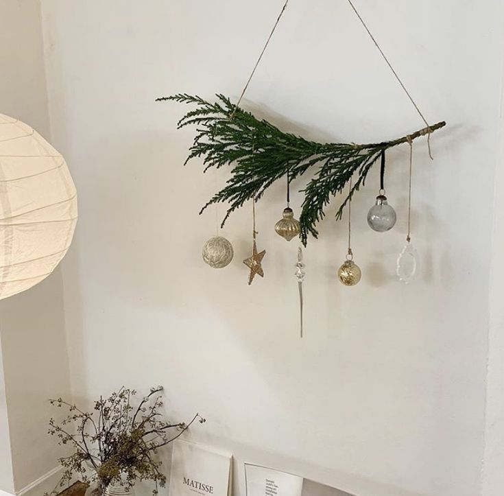 christmas decorations hanging from the wall in a room