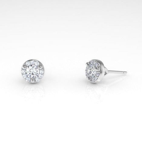 A diamond halo gives these classic, white diamond studs an extra sparkle. The Arcus collection highlights gemstone qualities through simple and clean designs, making these earrings appropriate for everyday wear. But the extra sparkle makes these Arcus Halo studs perfect for special occasions. Recycled metals White diamonds Approximately .2 total carat weight Handcrafted and made-to-order White Gold Round Cluster Earrings With Halo, Everyday White Diamond Earrings With Prong Setting, White Round Halo Cluster Earrings, Elegant Lab Grown Diamond Halo Earrings, Elegant Halo Lab Grown Diamond Earrings, White Brilliant Cut Round Cluster Earrings, White Round Cluster Earrings With Halo, Minimalist White Diamond Earrings With Brilliant Cut, Classic Halo Round Cut Earrings