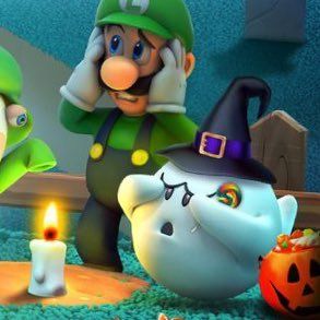 mario kart and luigi in front of some pumpkins with candles on the ground