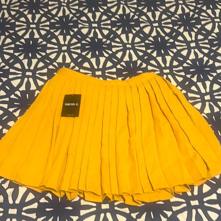 Forever 21 Yellow Mini Skirt. Never Worn! Chic Yellow Pleated Bottoms, Spring Yellow Pleated Mini Skirt, Yellow Pleated Tennis Skirt For Spring, Spring Yellow Pleated Tennis Skirt, Chic Yellow Mini Skort, Yellow Pleated Mini Skirt For Summer, Summer Yellow Fitted Pleated Skirt, Yellow Fitted Tennis Skirt For Summer, Yellow Pleated Party Bottoms