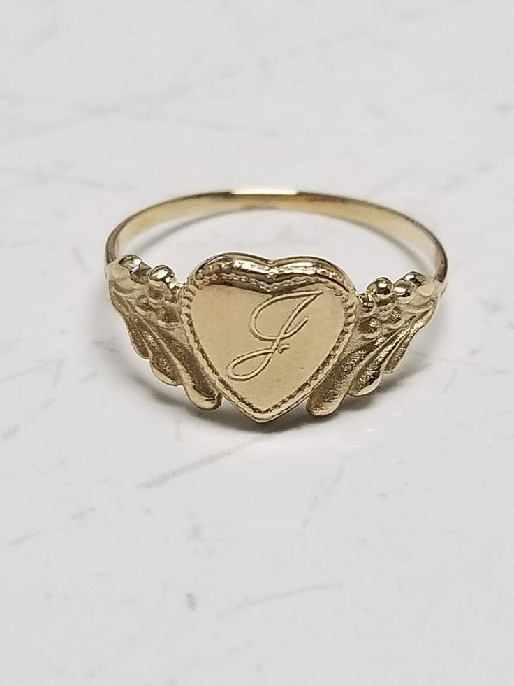 "Thanks for shopping our vintage estate store. We tend to sell well below wholesale and truly hope you enjoy all of our items. Many of the items are one of a kind, so please enjoy scrolling through the pictures and hopefully something will catch your eye. Brown spots are from camera or reflections. Estate 14k yellow gold monogram cursive capital J heart ring. Custom made ring for our shop. Ring size: 3 Setting: 7.5mm 1/4\" to 3/8\" Band width: 1.4mm Weight: .97 gram Marked 14k and it's sweet. On Antique Personalized Signet Ring For Anniversary, Heirloom 14k Gold Jewelry For Valentine's Day, Valentine's Day Heirloom 14k Gold Jewelry, Vintage Yellow Gold Engraved Promise Ring, Antique Personalized Engraved Gold Ring, Victorian 14k Gold Jewelry For Valentine's Day, Vintage Engraved Rings For Valentine's Day, Vintage Ring Jewelry For Valentine's Day, Heirloom Engraved Heart Ring For Anniversary