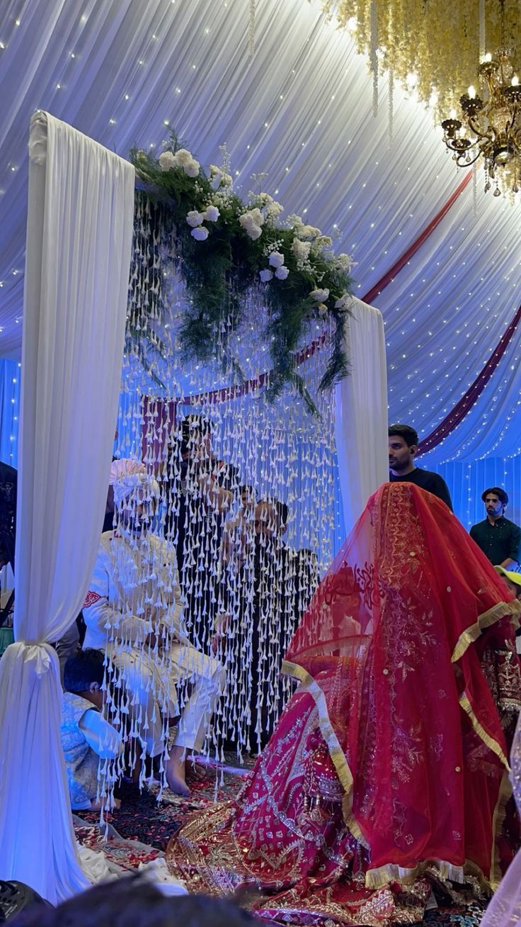 the bride and groom are getting ready to walk down the aisle in their wedding ceremony