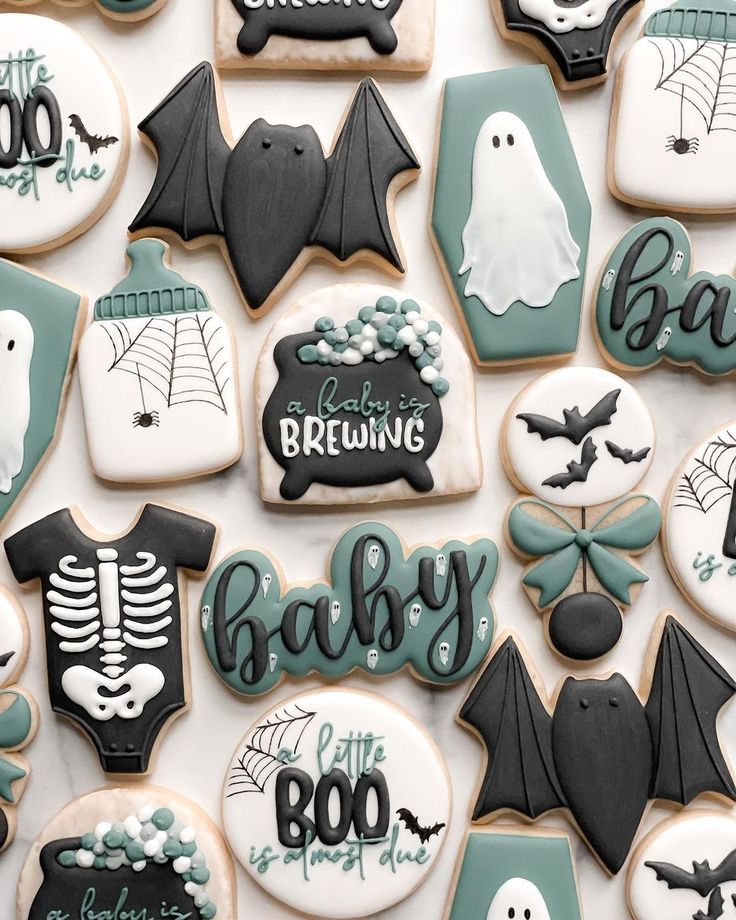 decorated cookies are arranged in the shape of bats, bats and ghostes for halloween