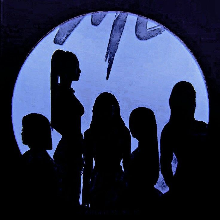 a group of people standing in front of a blue circle