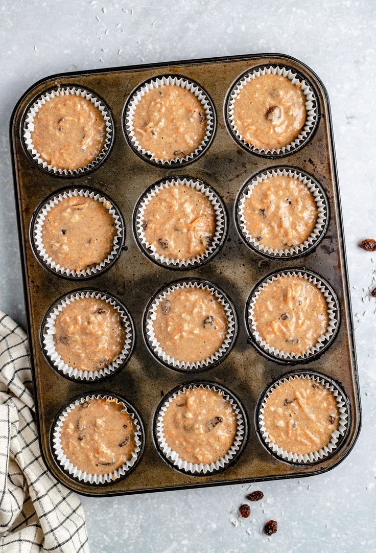 a muffin tin filled with cupcake batter