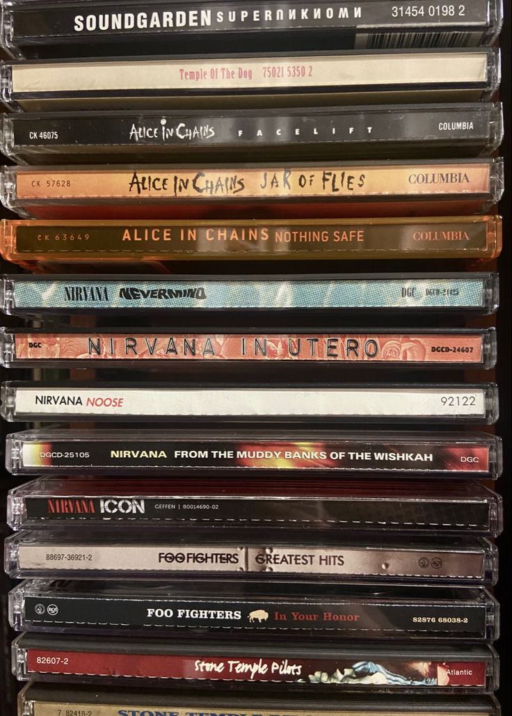 a stack of cds sitting on top of each other