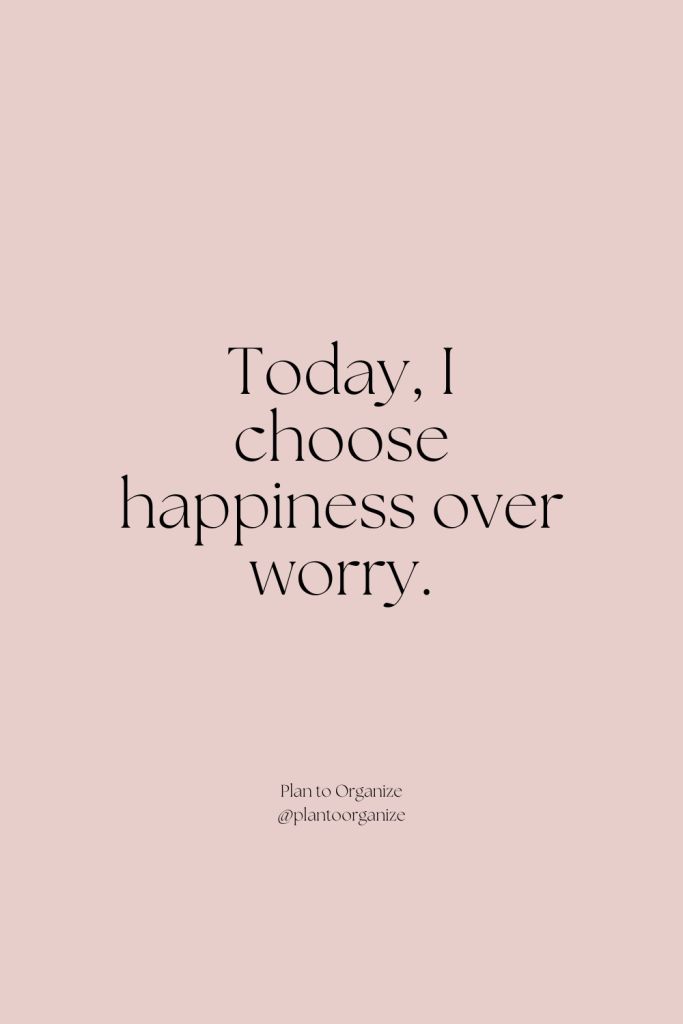 the words today, i choose happiness over worry in black and white on a pink background