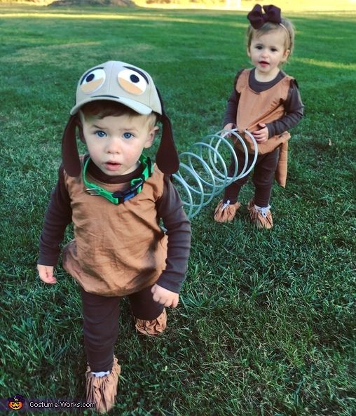 two young children dressed up in costumes