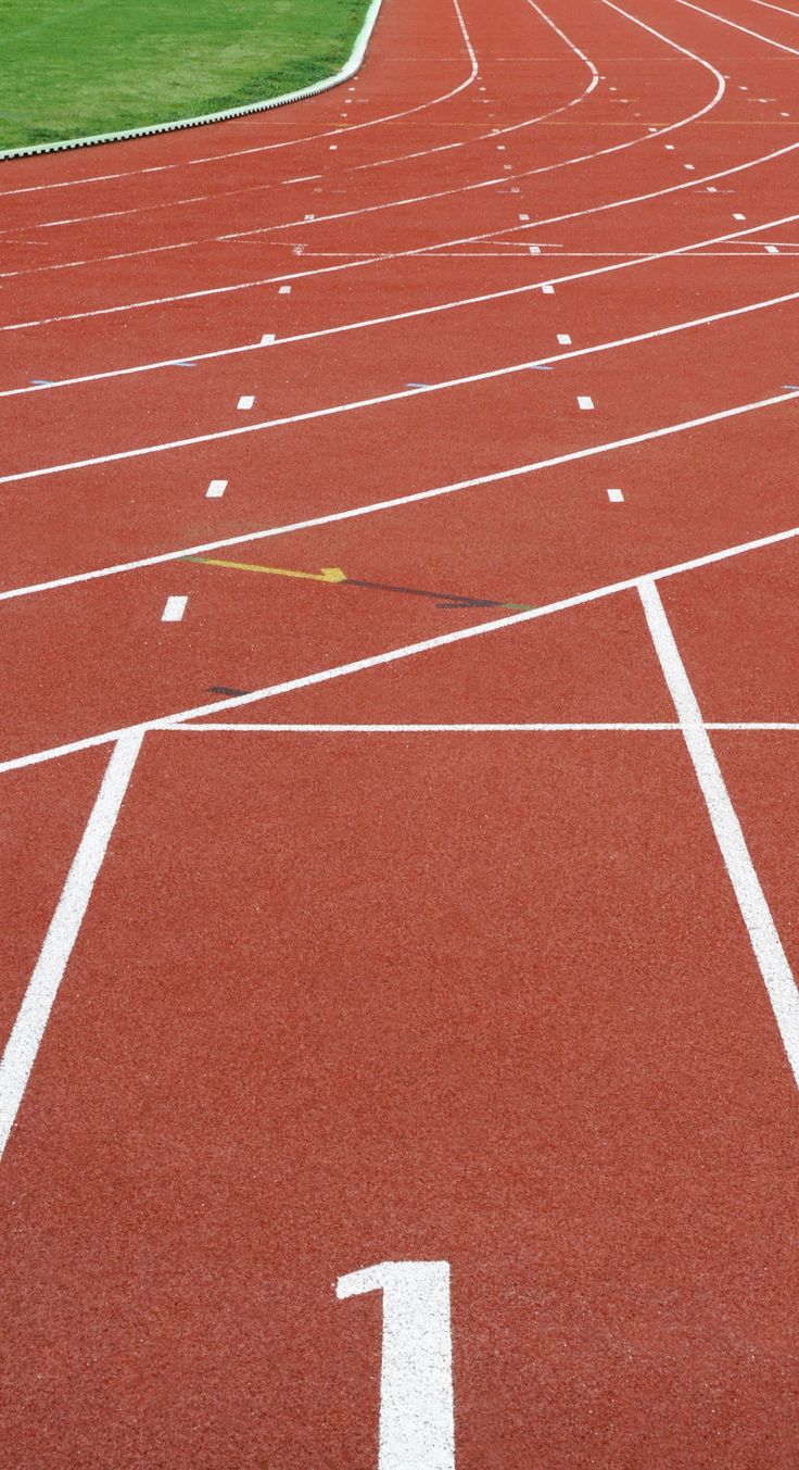 an empty running track with numbers painted on it