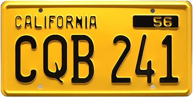 a yellow california license plate with the word cob 247 on it's front