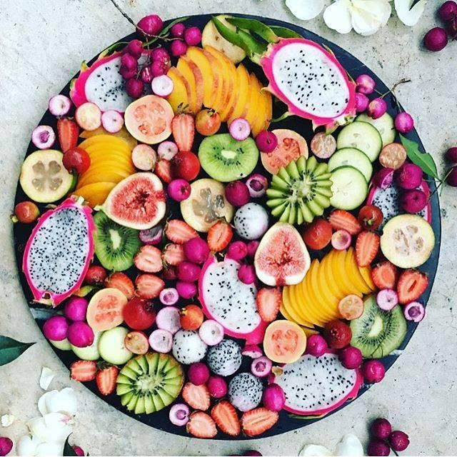 a platter filled with different types of fruit