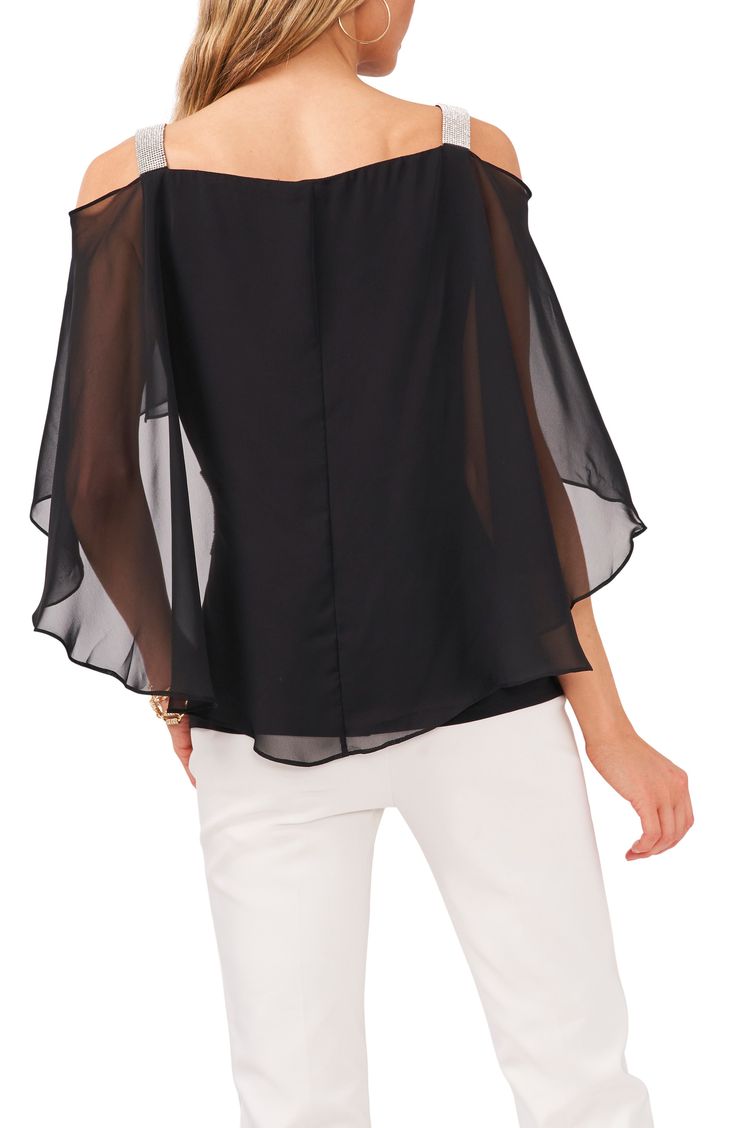 Pop on this light and airy off-the-shoulder top that showcases a sheer cape overlay at the back and glittering rhinestones at the shoulders and side. 95% polyester, 5% spandex Hand wash, line dry Imported Sheer Cape, Black Chiffon Blouse, Chiffon Sleeves, Blouse Nordstrom, Rhinestone Trim, Off The Shoulder Top, Chiffon Blouse, Three Quarter Sleeves, Cold Shoulder