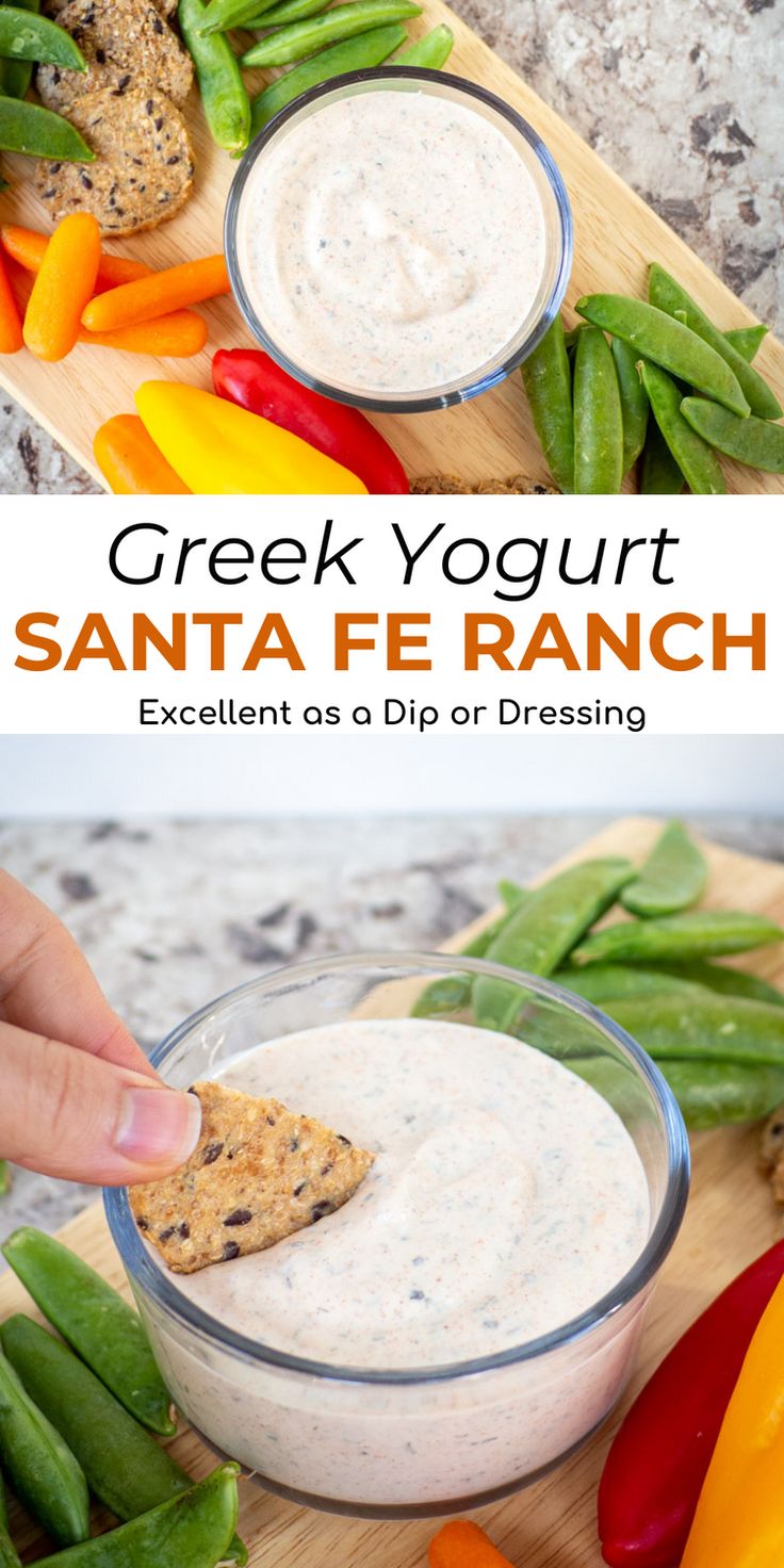 a hand dipping a cracker into a bowl of ranch dressing with green beans and peppers on the side