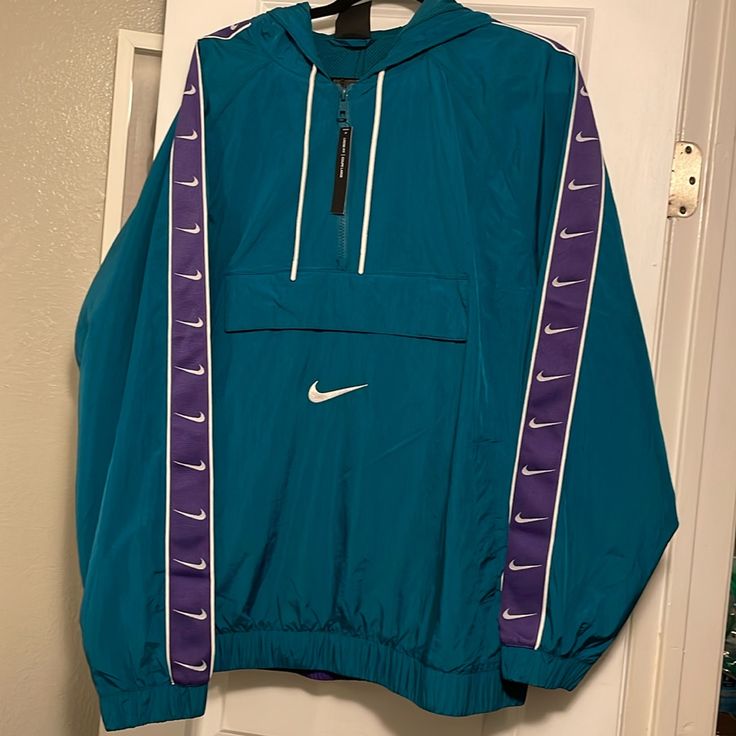 Jacket Teal/White/Court Purple/White Nike Blue Track Jacket For Spring, Nike Blue Long Sleeve Windbreaker, Nike Blue Track Jacket For Streetwear, Nike Blue Outerwear For Streetwear, Blue Nike Windbreaker With Pockets, Nike Blue Windbreaker With Pockets, Spring Nike Track Jacket With Pockets, Blue Nike Outerwear For Fall, Nike Blue Outerwear For Fall