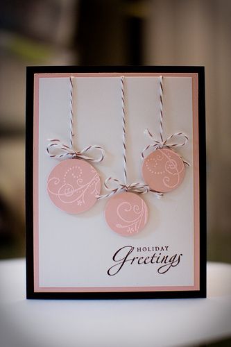 a close up of a greeting card with two tags on the front and one tag on the back