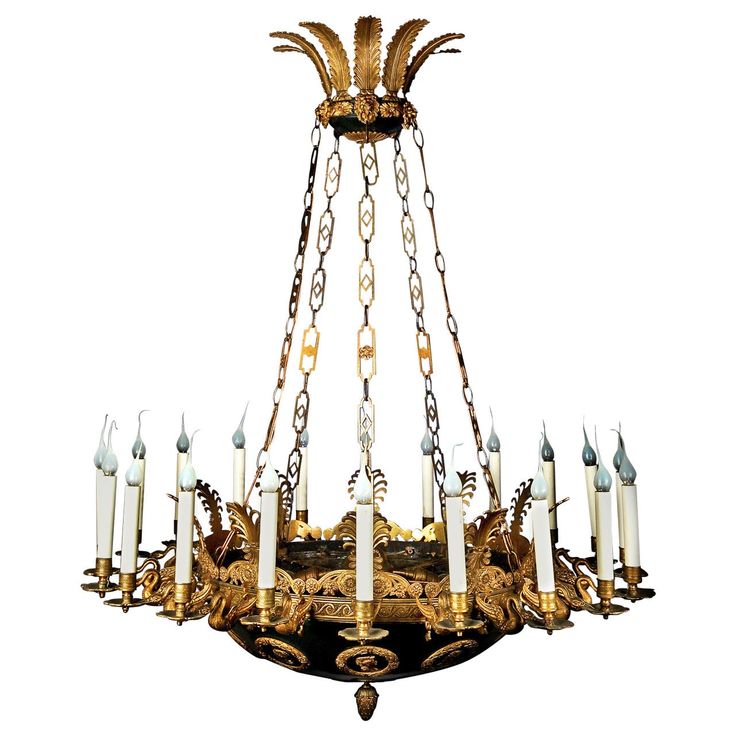 an antique chandelier with many candles hanging from it's arms and chains