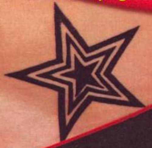 an image of a star tattoo on someone's stomach