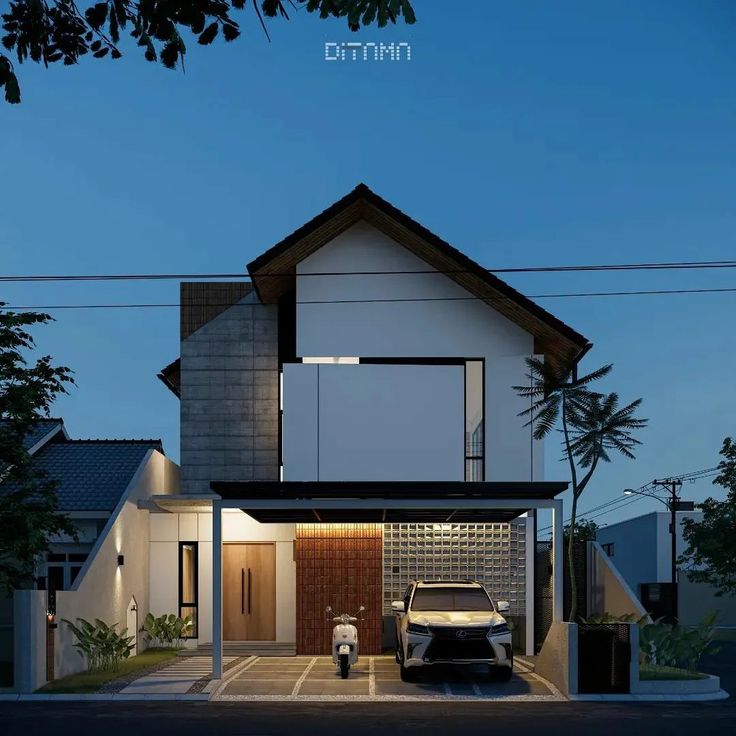 a car is parked in front of a modern house at night with the lights on