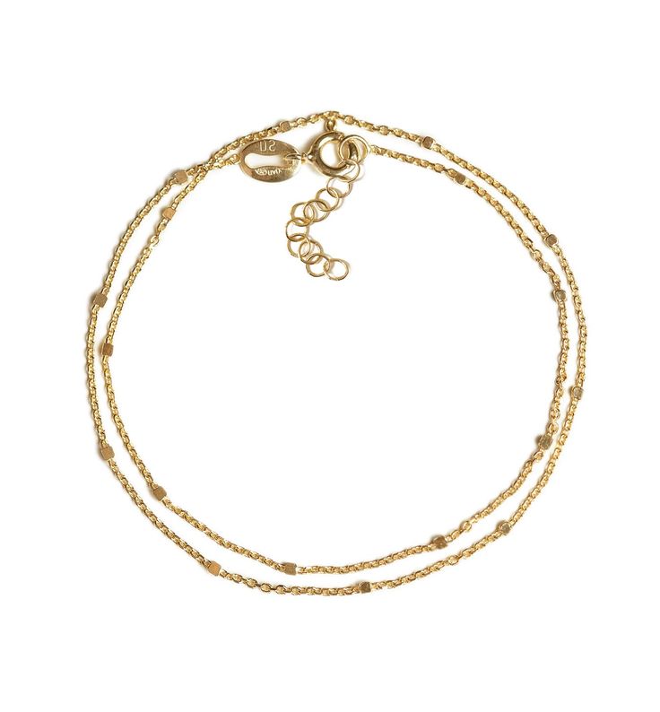 Minimal and dainty double chain wrap bracelet, perfect for layering with other bracelets or worn alone. The metal beads give off a subtle sparkle that is perfect for every occasion. Gold Vermeil Hypoallergenic, lead and nickel free Sizes: 6in(15.2cm), 6.75in(17cm) and 7.5in(19cm) Quality Italian Chain Width: 1mm Handcrafted in NYC #B043 Gold Multi-strand Beaded Bracelets For Layering, Gold Bracelets With Tiny Beads For Layering, Adjustable Double Strand Dainty Bracelet, Minimalist Delicate Chain Bracelet For Layering, Adjustable Gold Double Chain Bracelet, Adjustable Double Strand Gold Chain Bracelet, Classic Double Chain Bracelets For Everyday, Minimalist Everyday Bracelets With Double Chain, Adjustable Double Chain Bracelet For Everyday