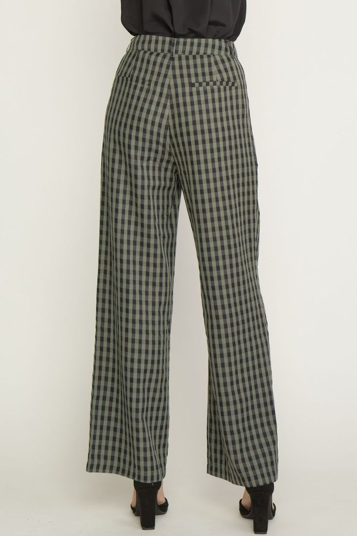 Elevate your style with our Olive Plaid Trousers! These high waisted, wide leg pants feature a playful gingham print and functional pockets. Belt loops and a zipper front closure add convenience and the lining offers comfort for all-day wear. Amp up your work wardrobe with these fun and functional trousers. 75% Polyester 25% Rayon Gingham Cotton Pants For Fall, Cotton Gingham Pants For Fall, Fall Gingham Cotton Pants, Chic Plaid Straight Leg Bottoms, Black Wide Leg Bottoms With Houndstooth Pattern, Chic Gingham Wide Leg Pants, Casual Gingham Wide Leg Bottoms, Gingham Cotton Bottoms For Fall, Casual Wide Leg Gingham Bottoms