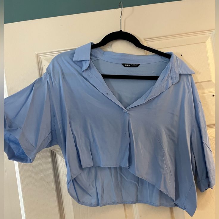 Blue Cropped Shirt From Shein Never Worn But Tags Are Taken Off Size L Please Message Me If You Would Like More Information Or Are Interested In Bundling! Spring Blue Collared Top, Trendy Blue V-neck Shirt, Blue Cropped Cotton Shirt, Blue Cotton Cropped Shirt For Summer, Trendy Collared Blue Blouse, Trendy Blue Collared Blouse, Trendy Light Blue Collared Top, Trendy Blue Cropped Short Sleeve Shirt, Blue Cropped Shirt For Spring